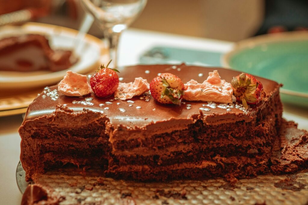a chocolate cake with strawberries on top of it