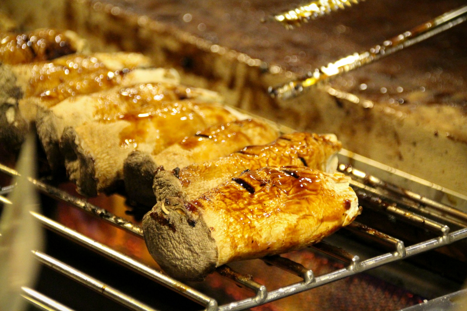 a close up of food cooking on a grill